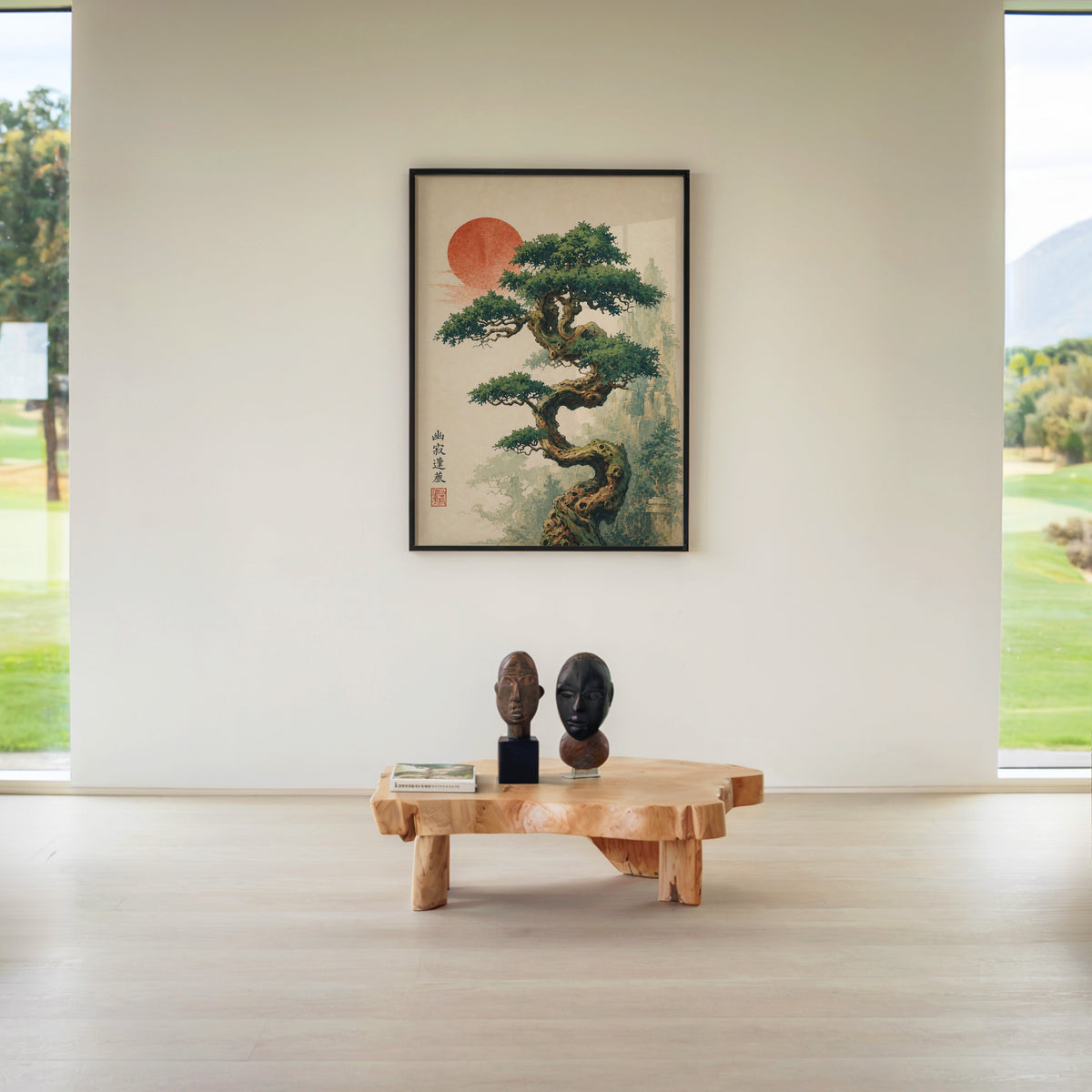 twisted bonsai tree with red sun print in a black frame above a live-edge wood coffee table between garden windows