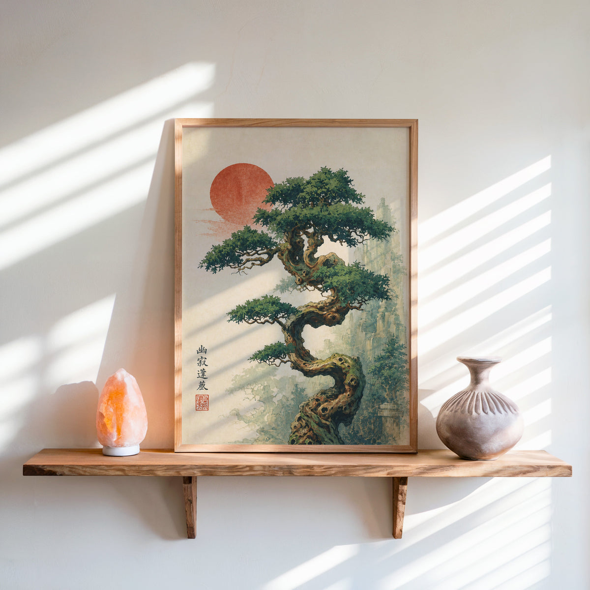 twisted bonsai tree with red sun print in an oak frame on a live-edge wall shelf with a salt lamp and clay vase