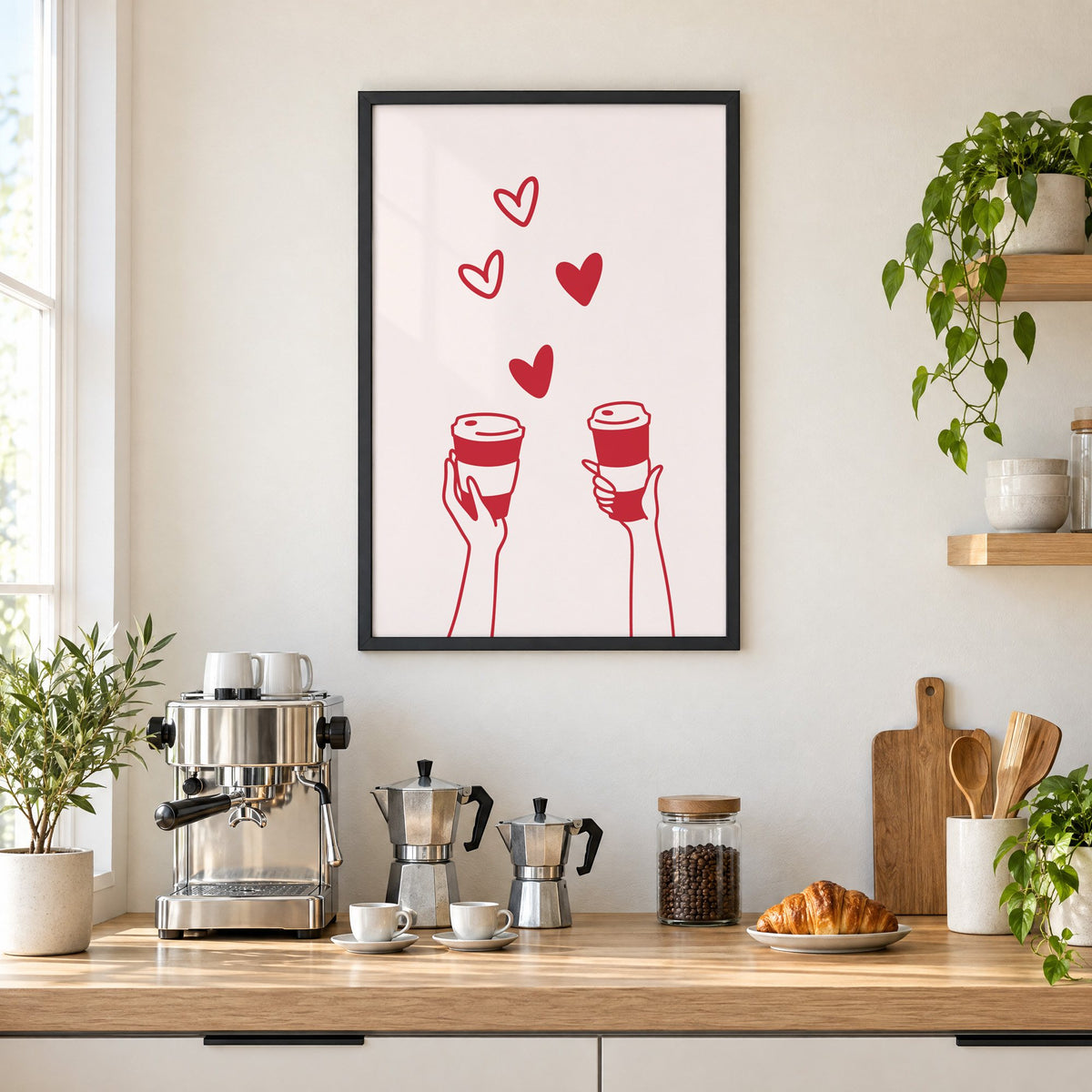 Two hands coffee cups and hearts red line print in a black frame above a home espresso bar with moka pots and espresso cups