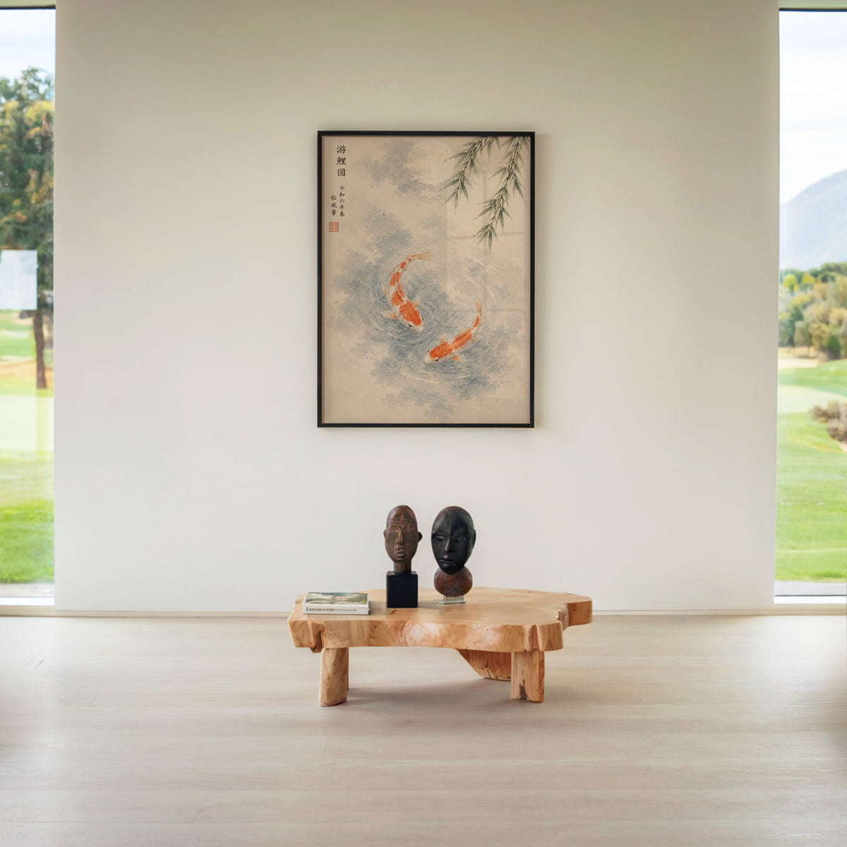 two koi with willow and moon print in a black frame above a live-edge wood coffee table between garden windows