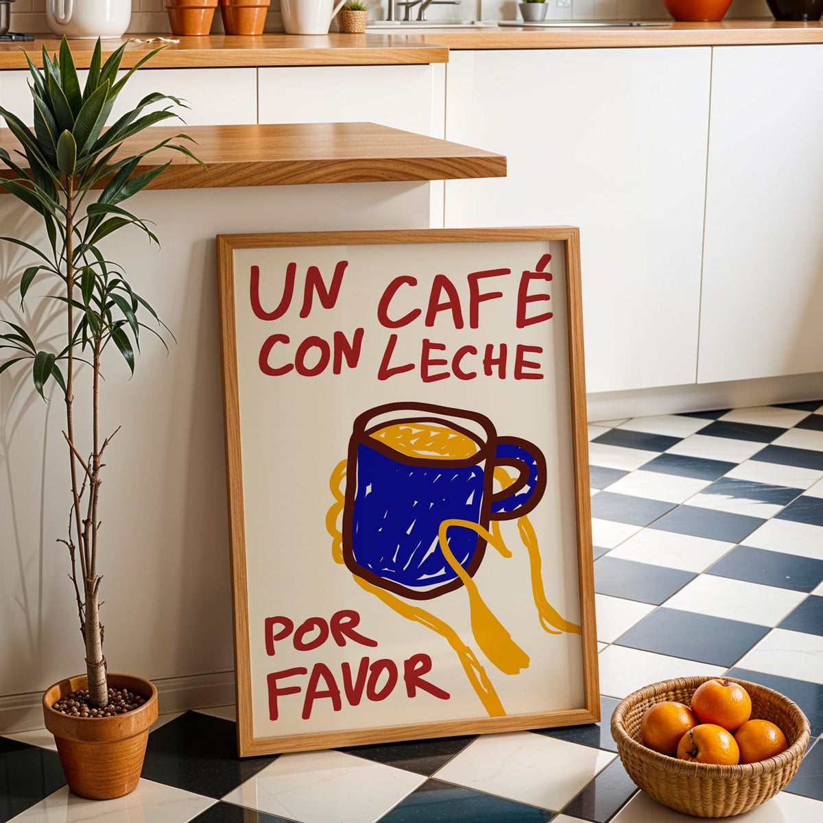Un cafe con leche print in an oak frame by a kitchen island and checkered floor