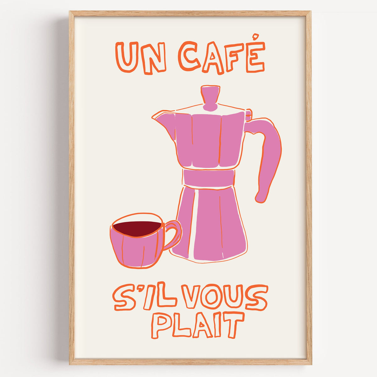 Un cafe pink moka pot print in a light oak frame on a plain white wall