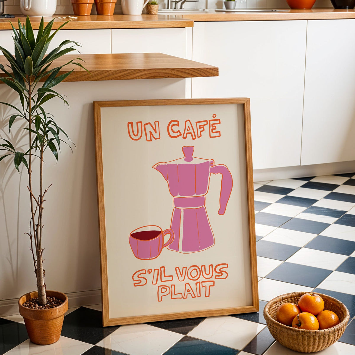 Un cafe pink moka pot print in an oak frame by a kitchen island and checkered floor