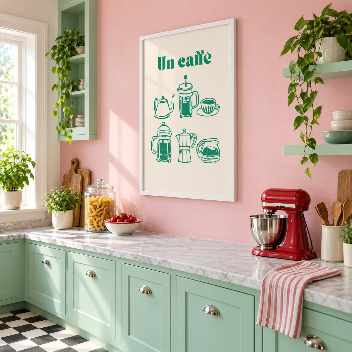 Un caffè green coffee makers print in a white frame on a pink wall above mint green cabinets in a retro kitchen, seen at an angle