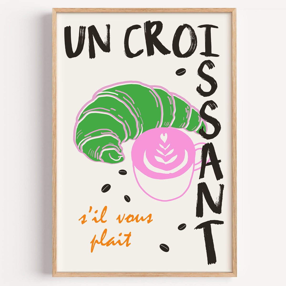Un croissant french bakery print in a light oak frame on a plain white wall