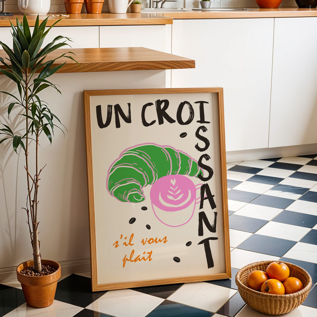 Un croissant french bakery print in an oak frame by a kitchen island