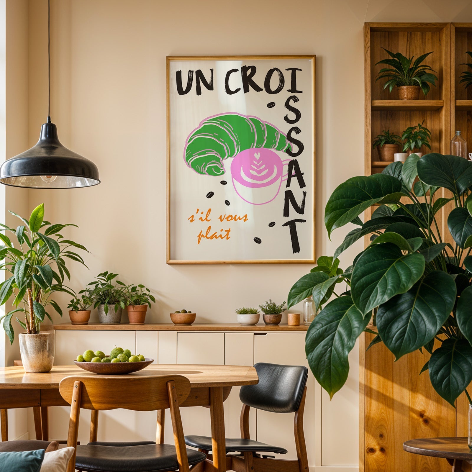Un croissant french bakery print in an oak frame above a sideboard in a dining room