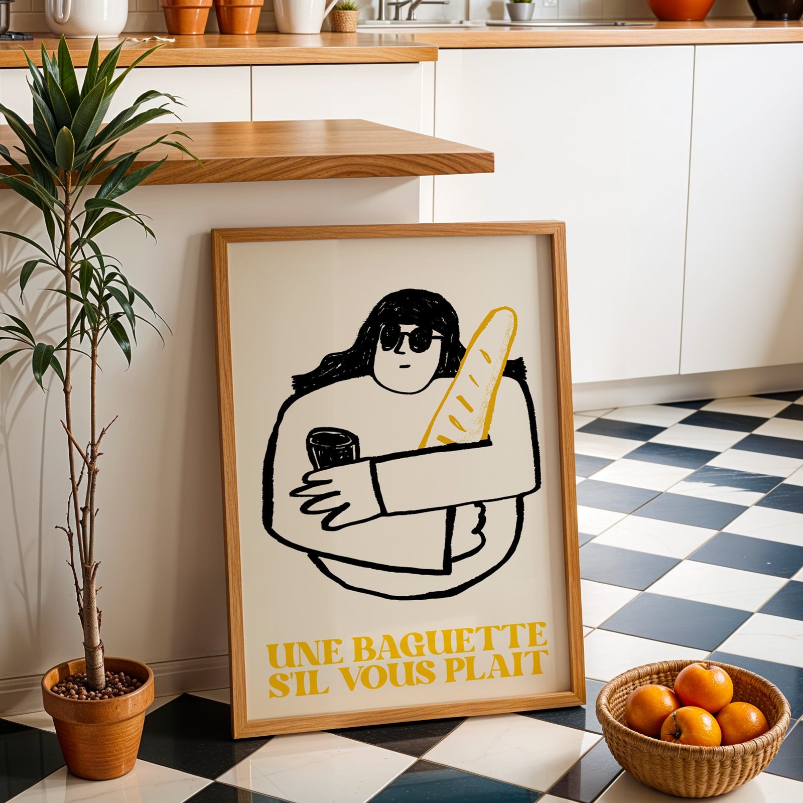 Une baguette french market print in an oak frame by a kitchen island