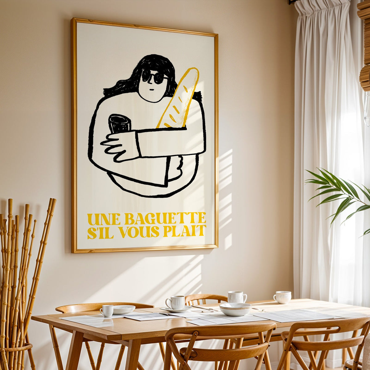 Une baguette french market print in a gold frame above a sunlit breakfast table