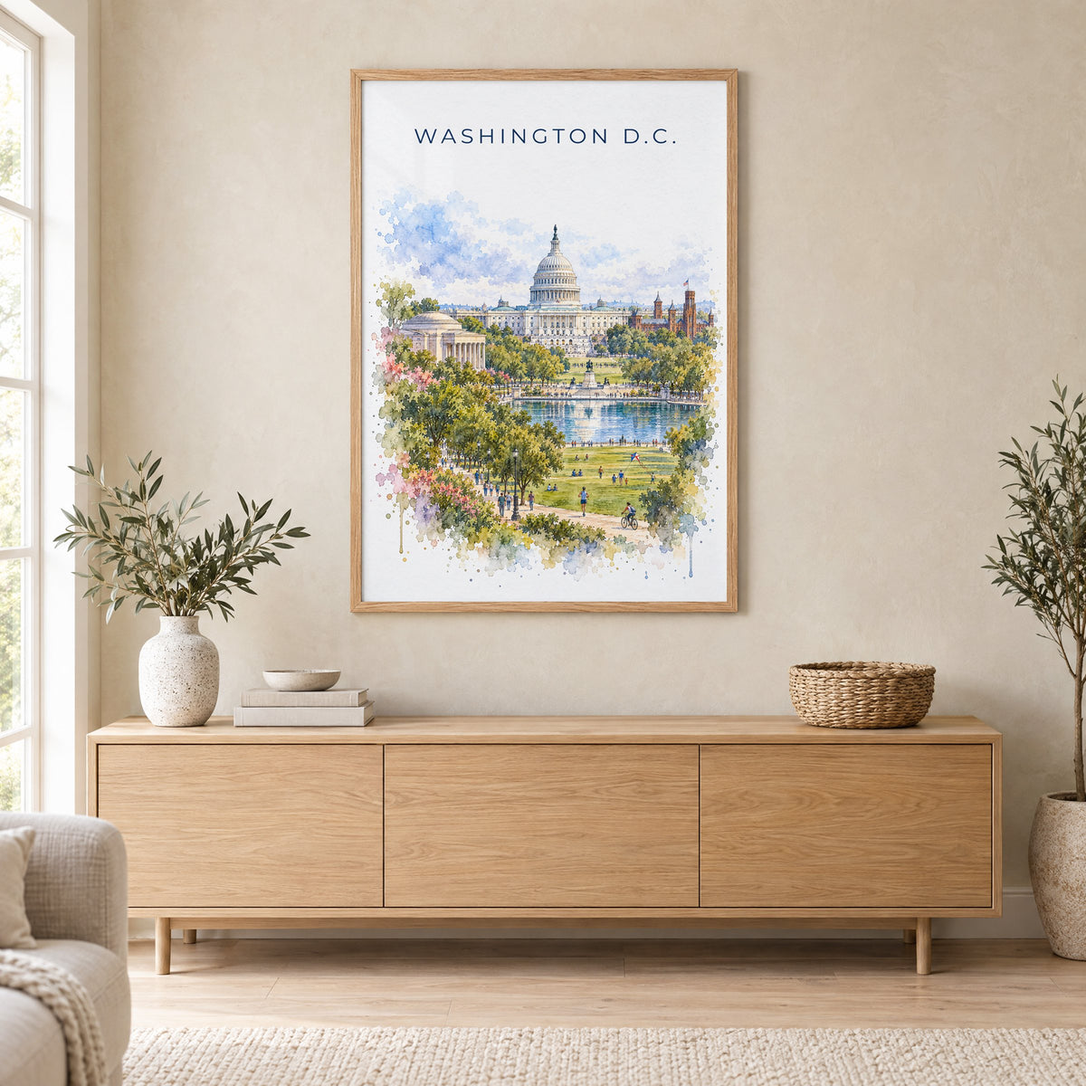 U.S. Capitol watercolor print in an oak frame above a light wood sideboard in a Scandinavian living room