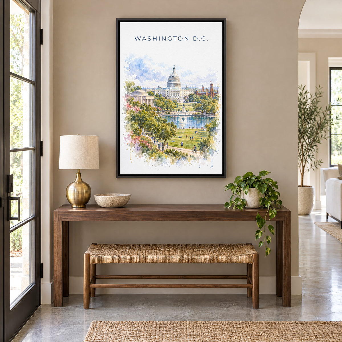 U.S. Capitol watercolor print as a black floater canvas above a walnut console and woven bench in an entryway