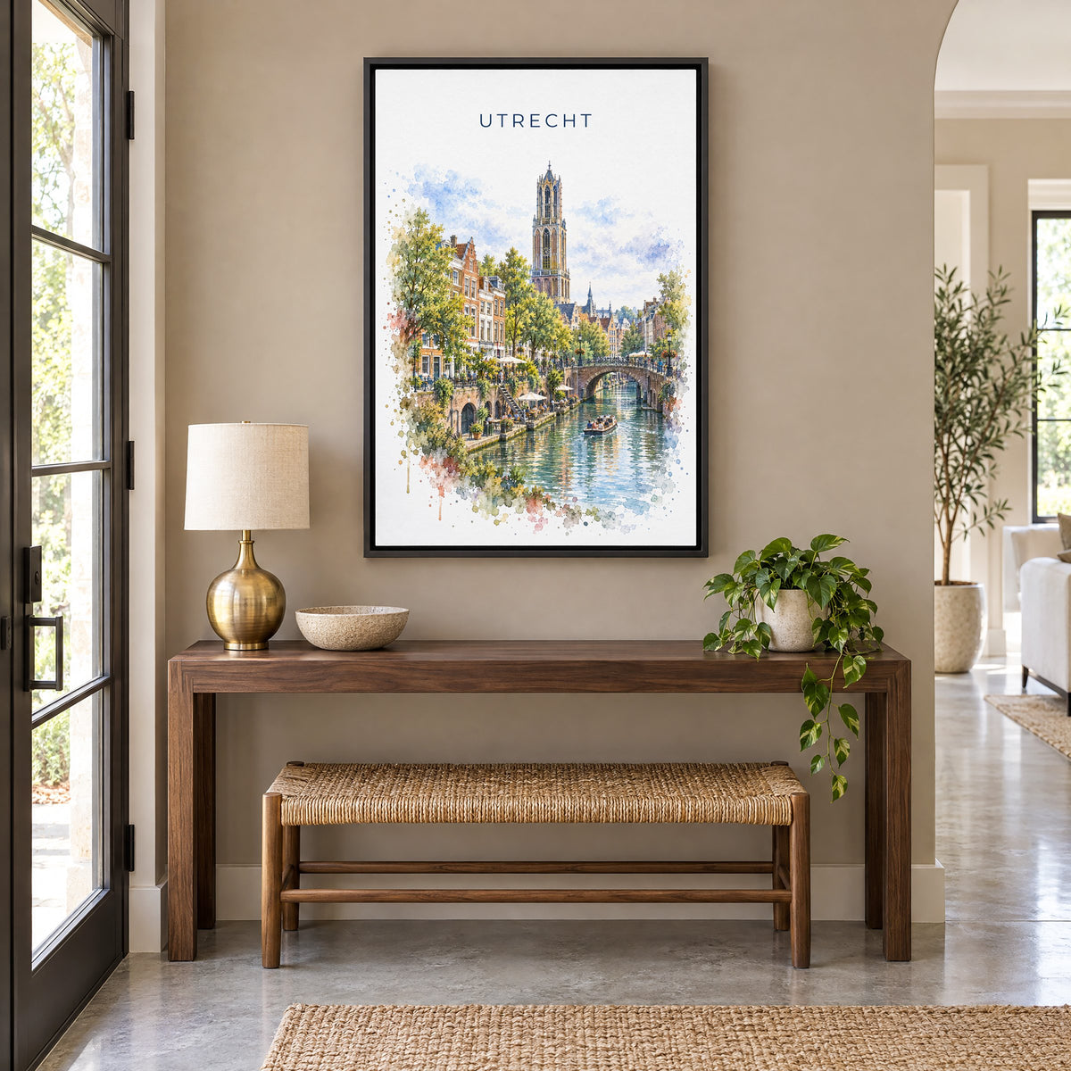 Utrecht watercolor print as a black floater canvas above a walnut console and woven bench in an entryway