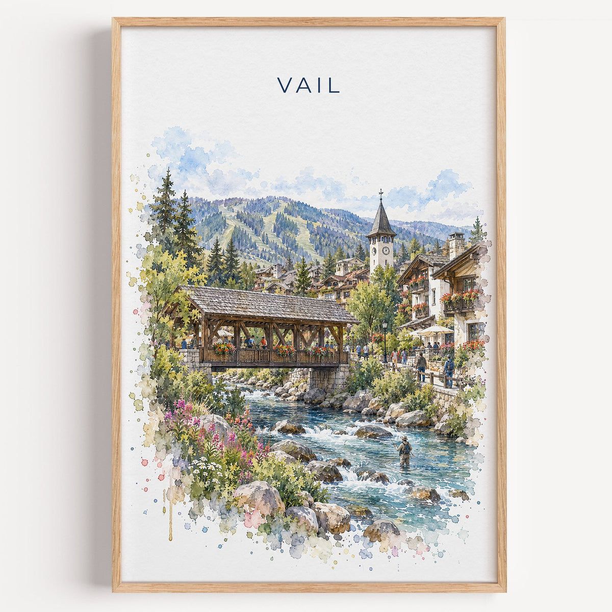 Vail, Colorado watercolor print in a light oak frame on a plain white wall