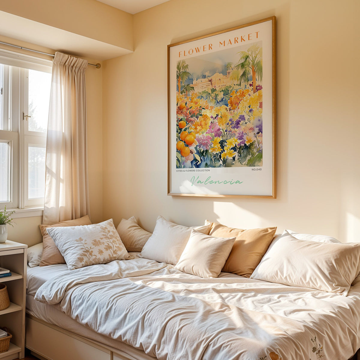 Valencia flower market print in an oak frame above a cream daybed in a sunny bedroom