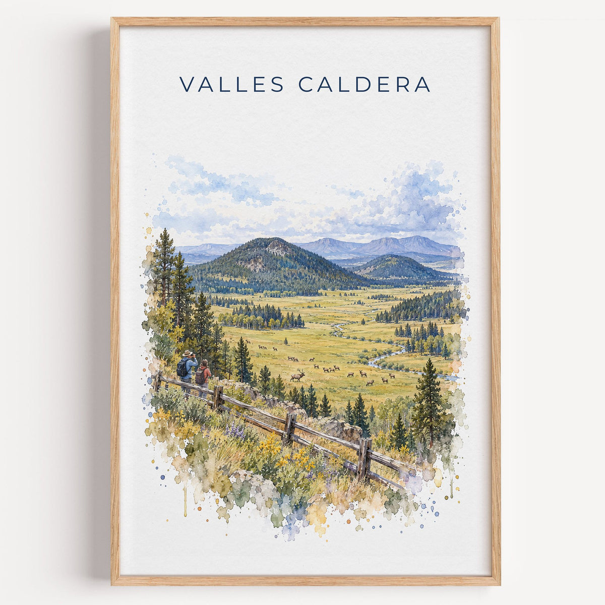 Valles Caldera National Preserve watercolor print in a light oak frame on a plain white wall