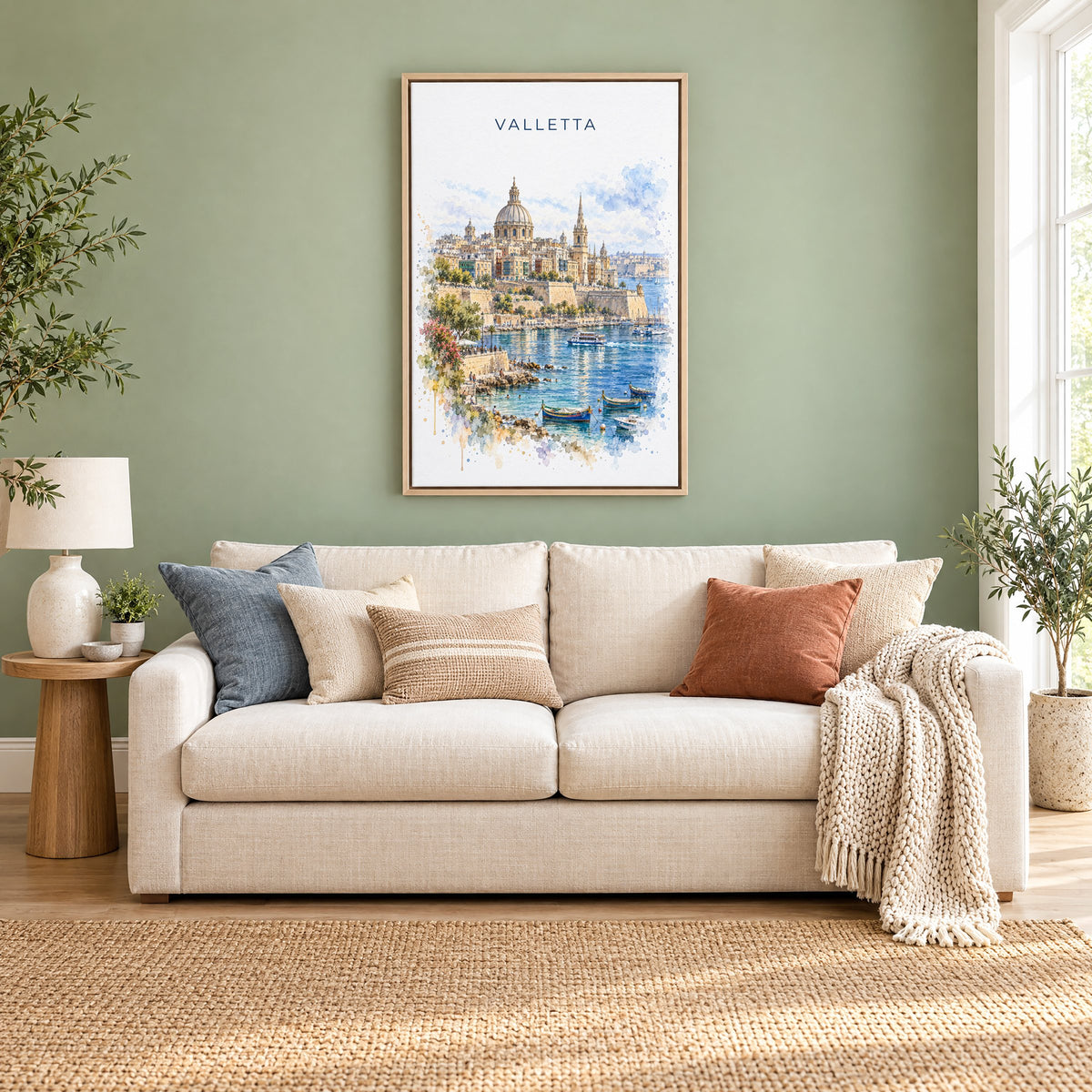 Valletta watercolor print as a natural floater canvas above a cream linen sofa on a sage green wall