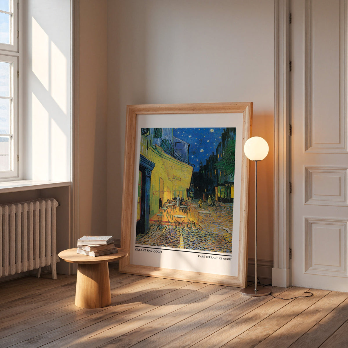 Van Gogh starry café print in a wide pine frame leaning by a sunlit window