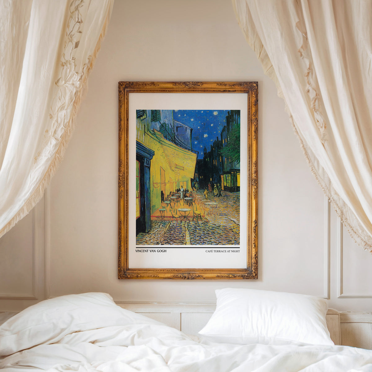 Café Terrace at Night print shown in an ornate gold frame above a canopy bed
