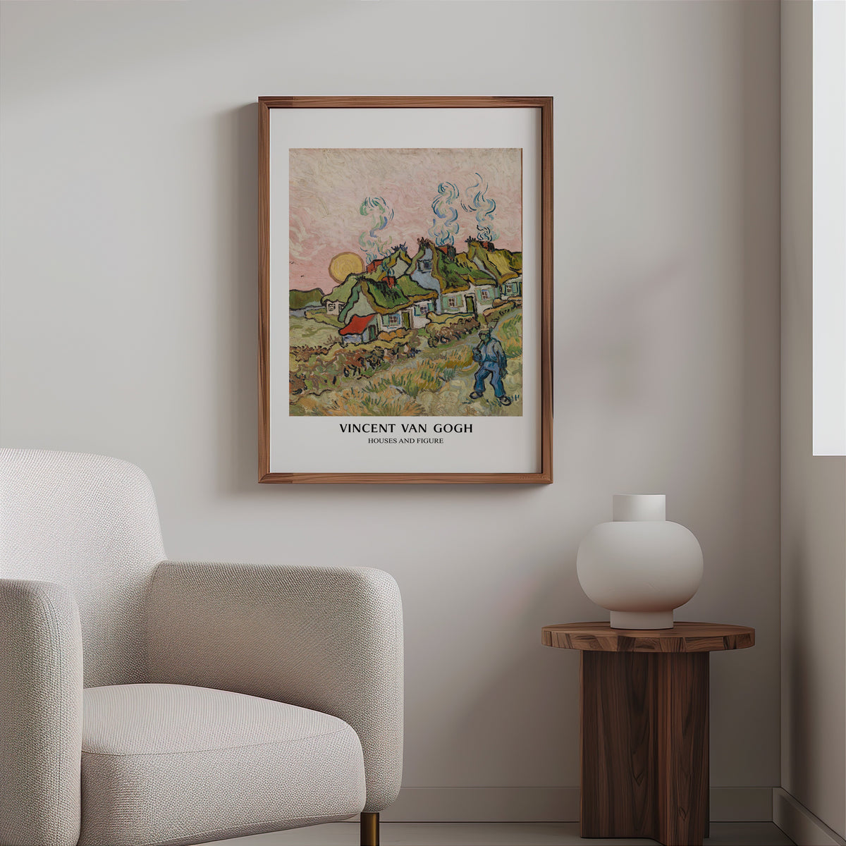 Van Gogh cottages print in a slim walnut frame above a bouclé armchair
