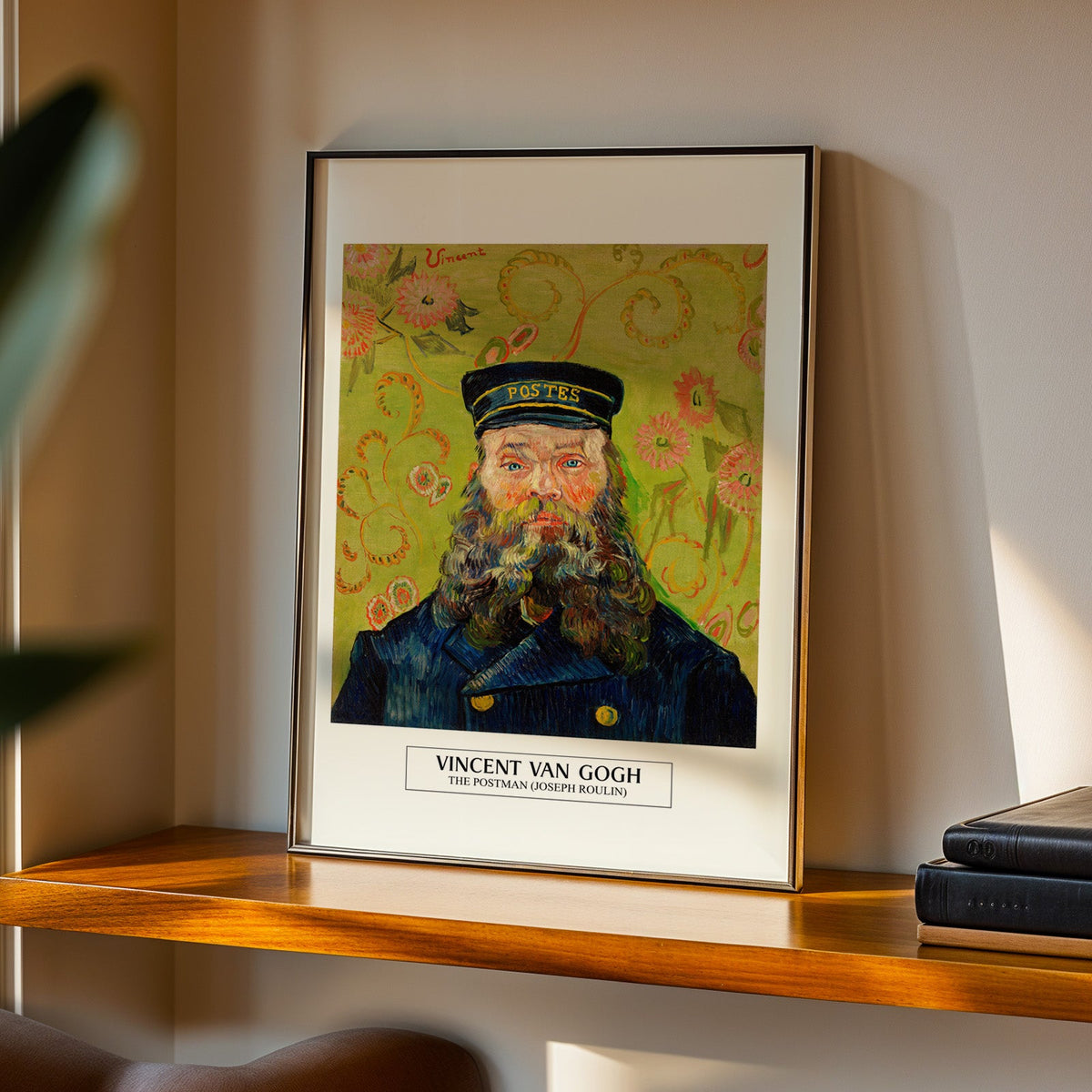 The Postman Joseph Roulin print in a black frame on a walnut shelf in evening light
