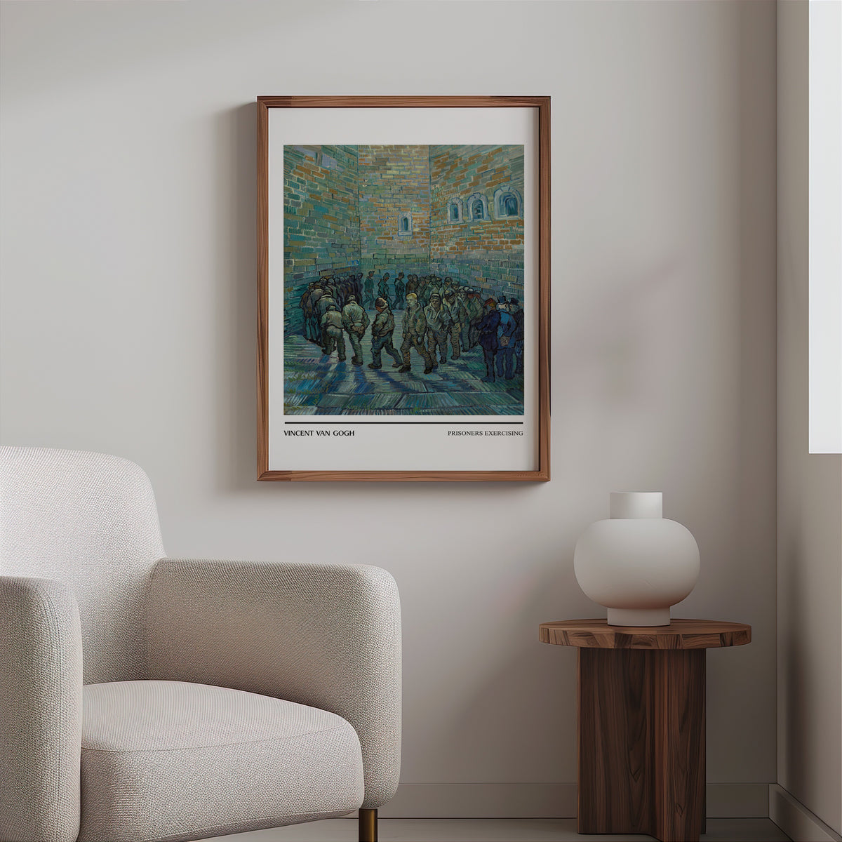 Van Gogh prison yard print in a slim walnut frame above a bouclé armchair