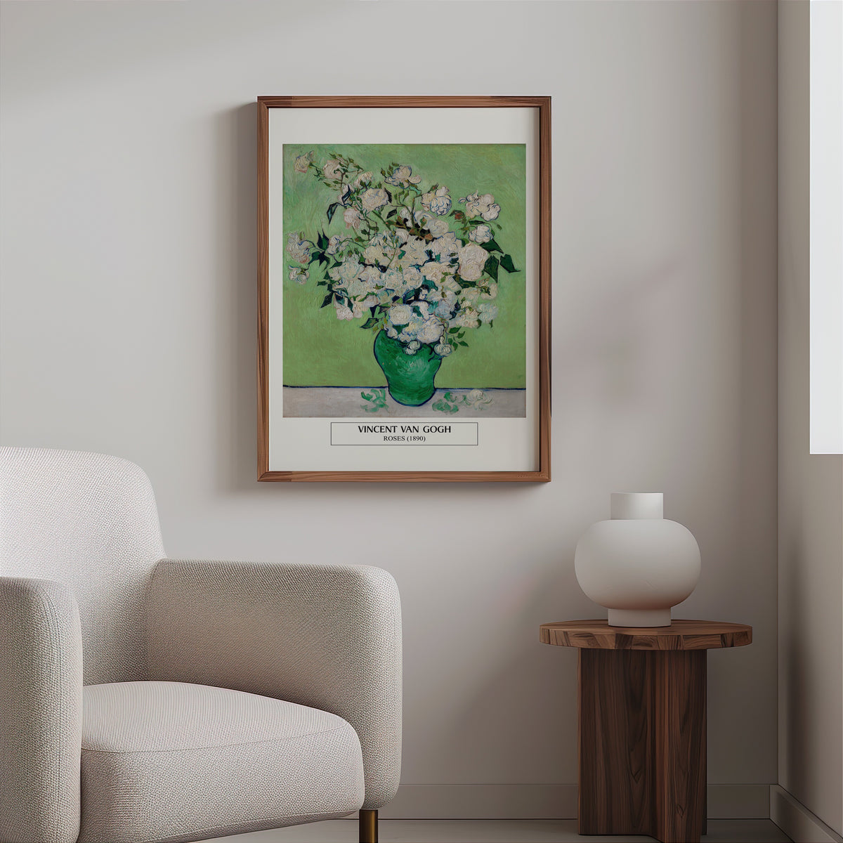 Van Gogh roses print in a slim walnut frame above a bouclé armchair