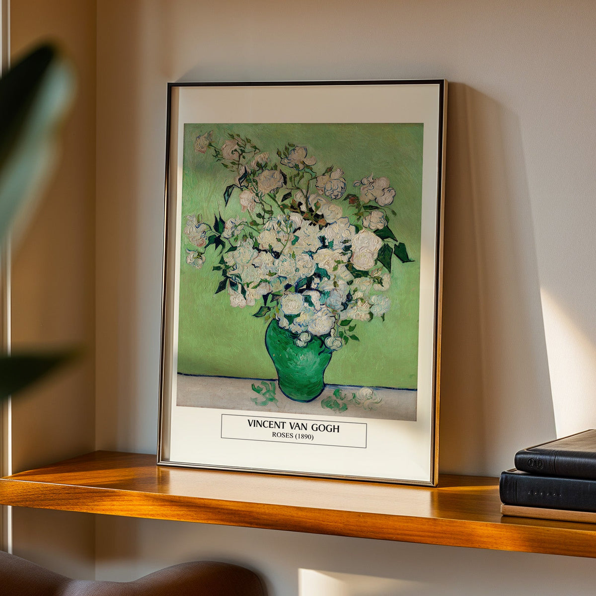 Van Gogh Roses print in a black frame on a walnut shelf in evening light
