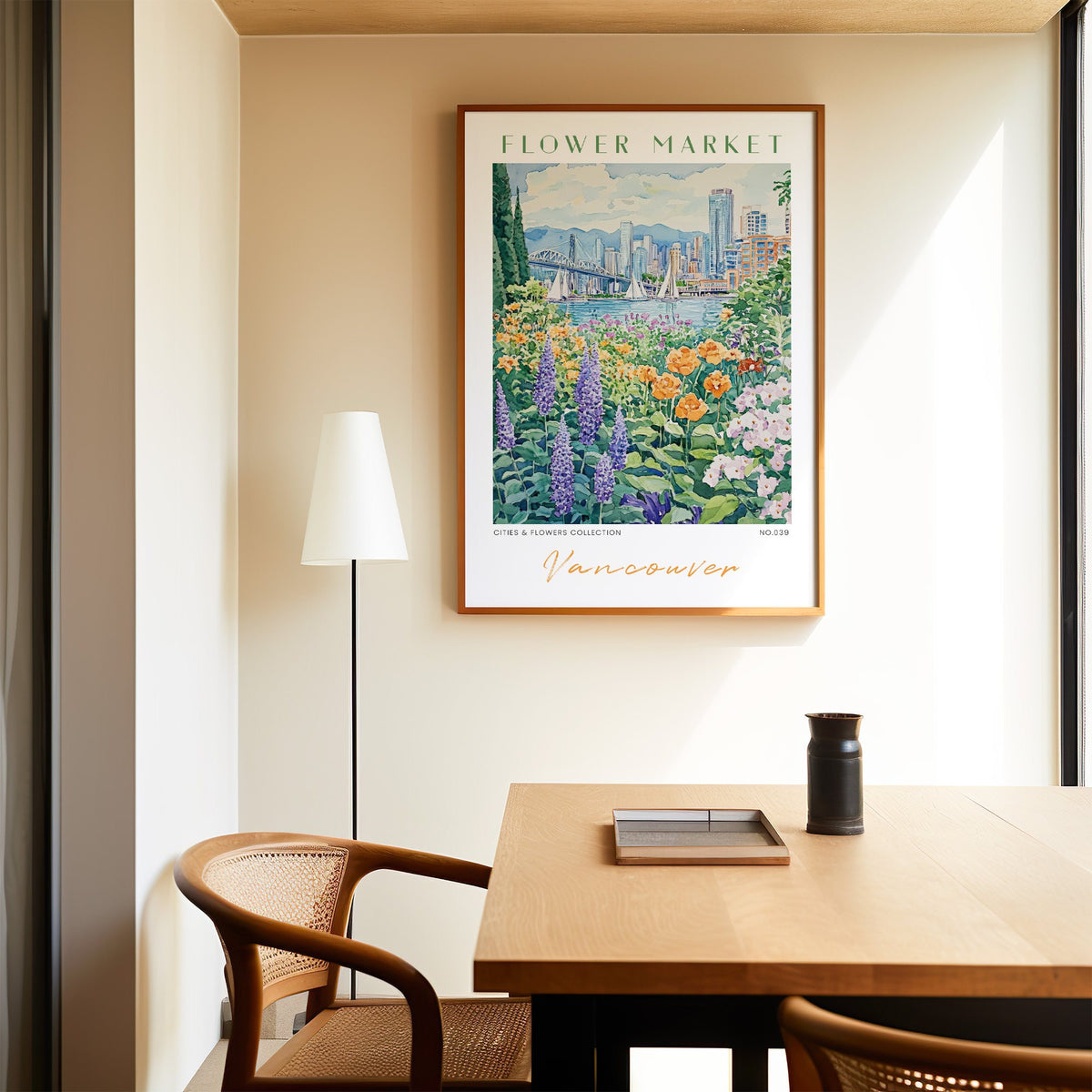 Vancouver flower market print in an oak frame above a dining table and cane chair