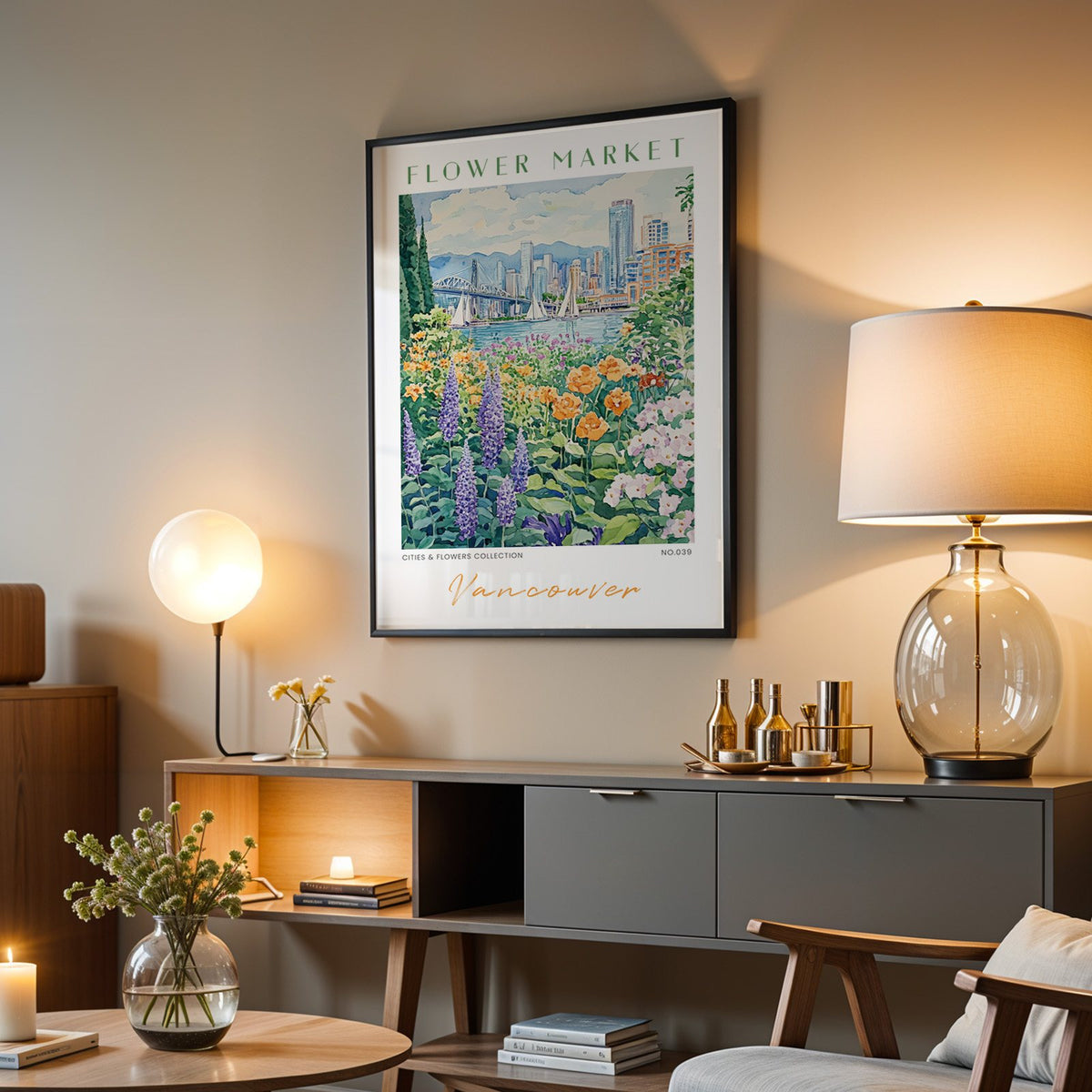 Vancouver flower market print in a black frame above a grey media console with a glass table lamp