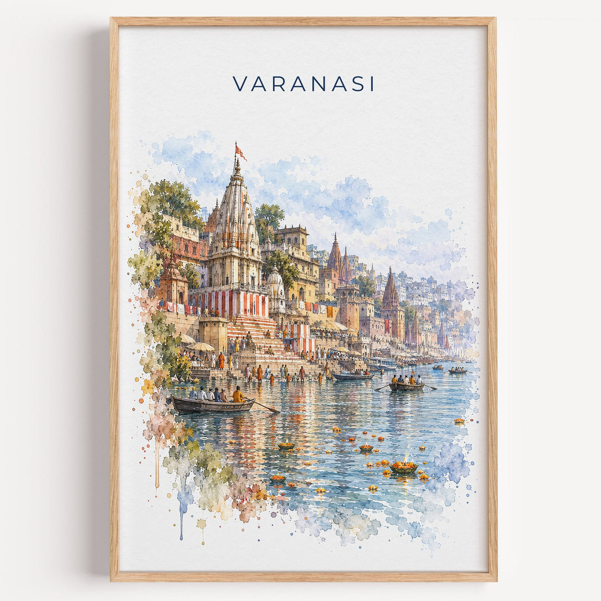 Varanasi watercolor print in a light oak frame on a plain white wall