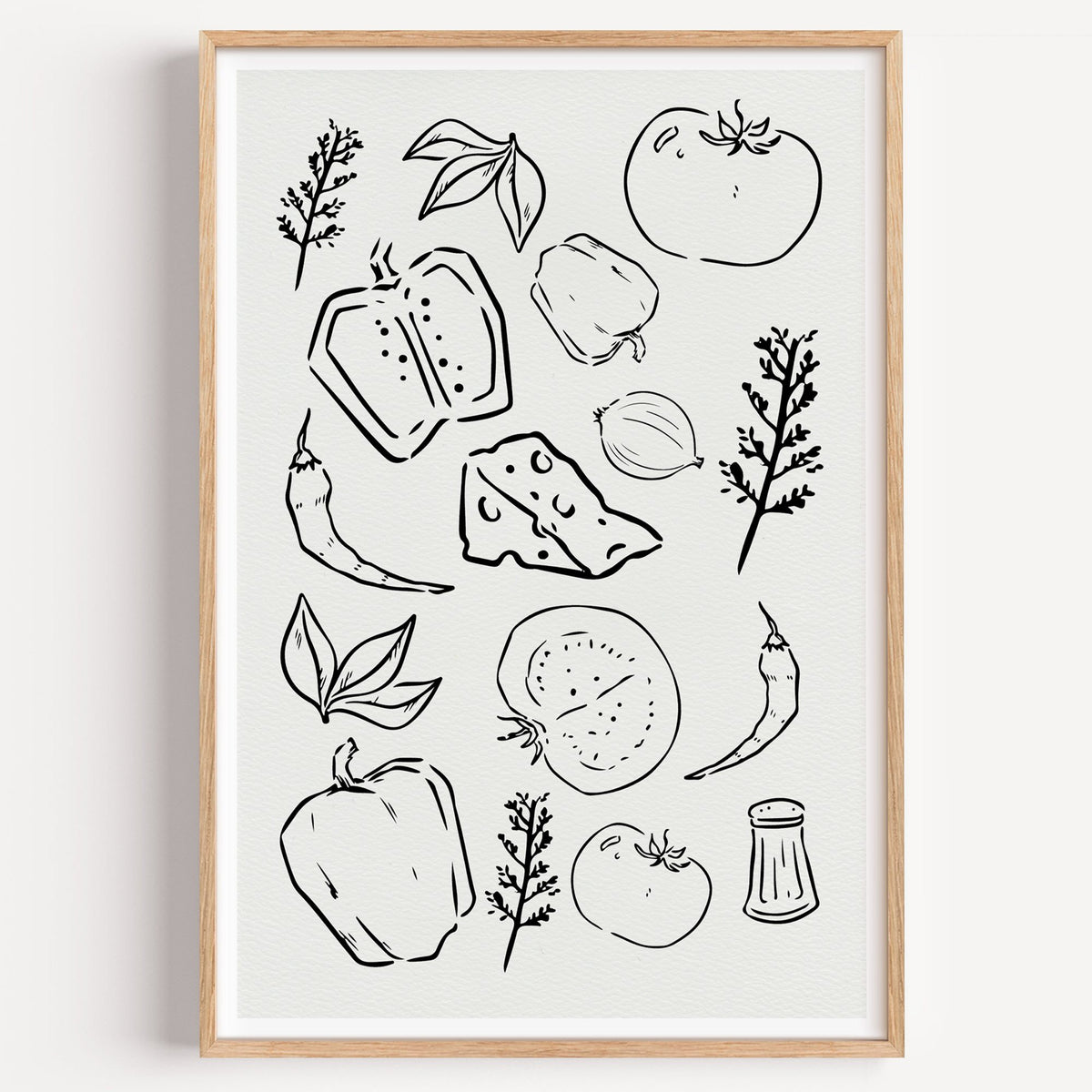 Veggie and cheese sketch on ivory print in a light oak frame on a plain white wall