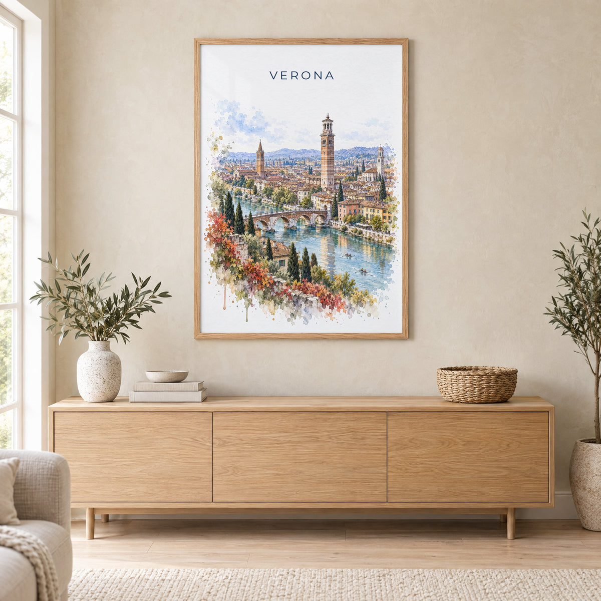 Verona watercolor print in an oak frame above a light wood sideboard in a Scandinavian living room