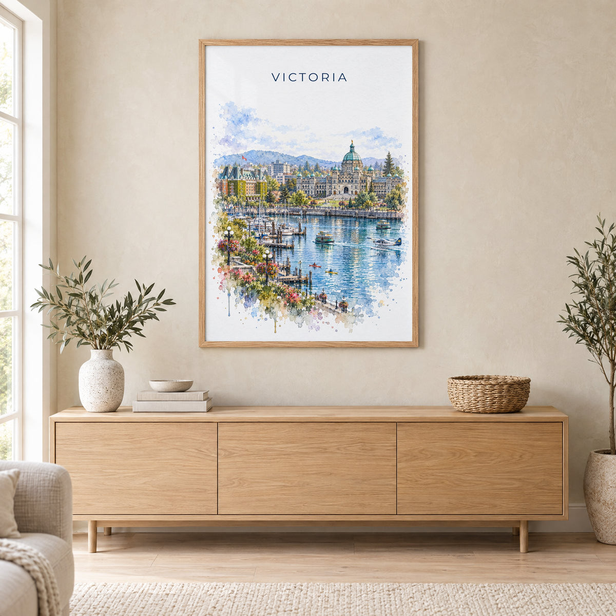 Victoria, Canada watercolor print in an oak frame above a light wood sideboard in a Scandinavian living room