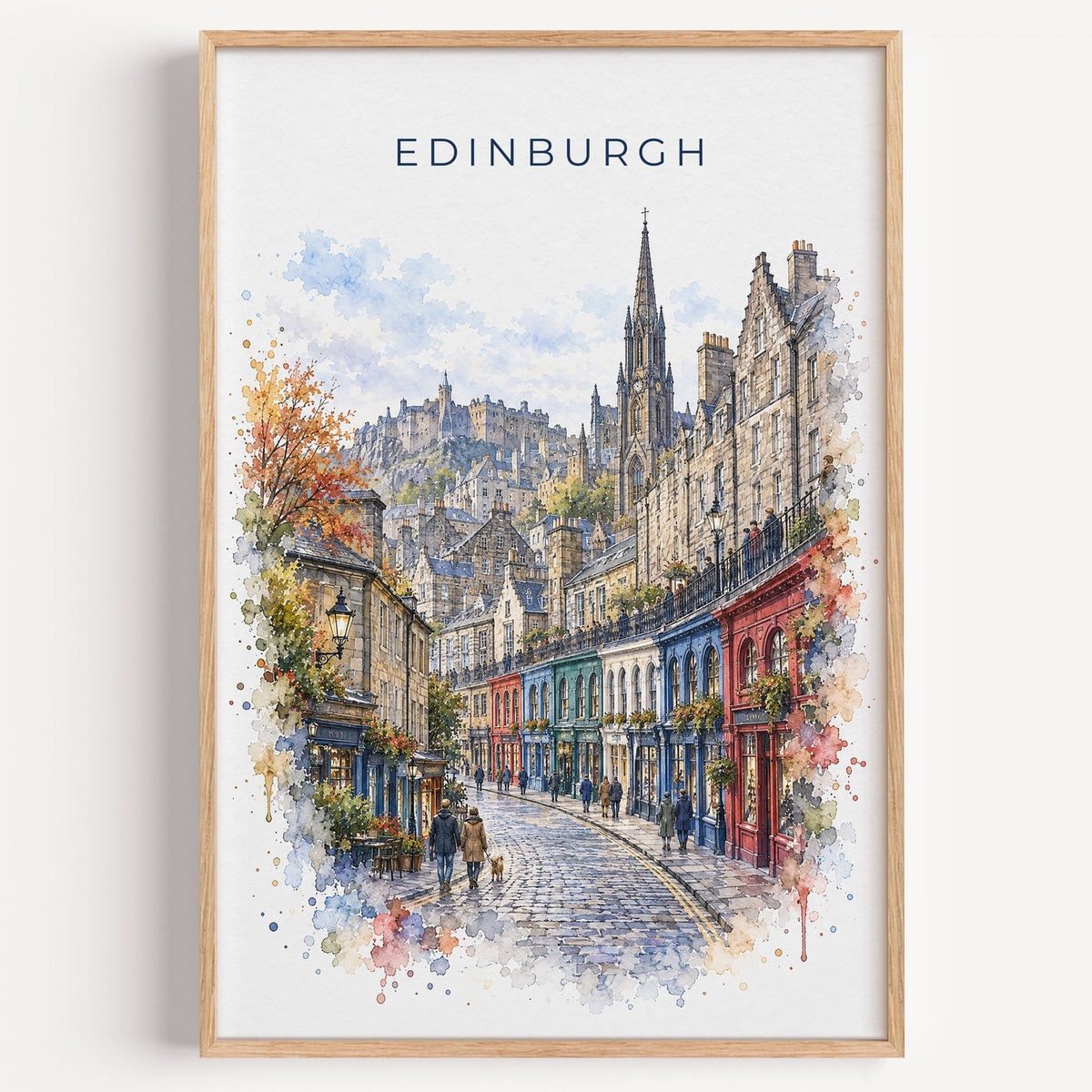 Victoria Street Edinburgh watercolor print in a light oak frame on a plain white wall