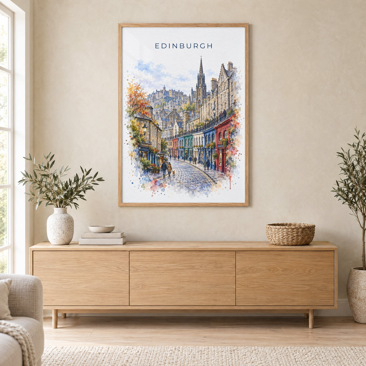 Victoria Street Edinburgh watercolor print in an oak frame above a light wood sideboard in a Scandinavian living room
