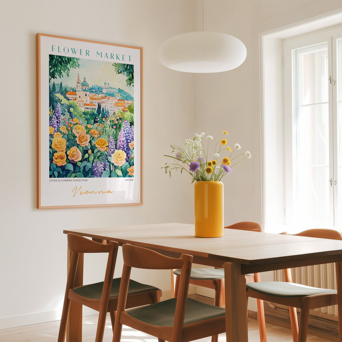 Vienna flower market print in an oak frame above a dining table with a yellow vase and white pendant light