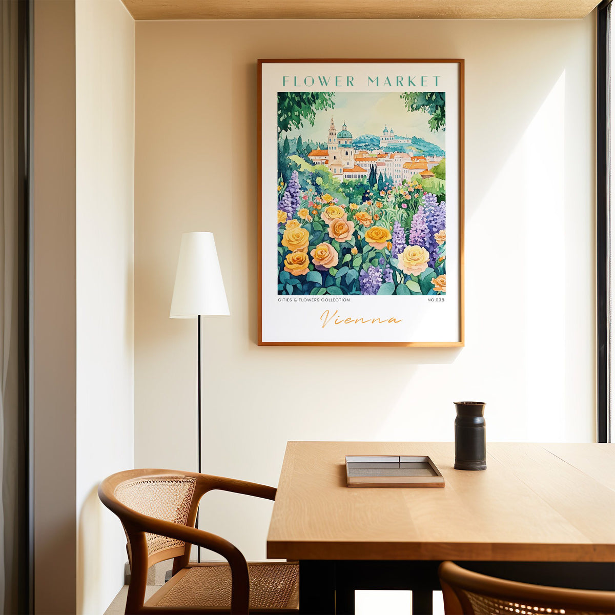 Vienna flower market print in an oak frame above a dining table and cane chair