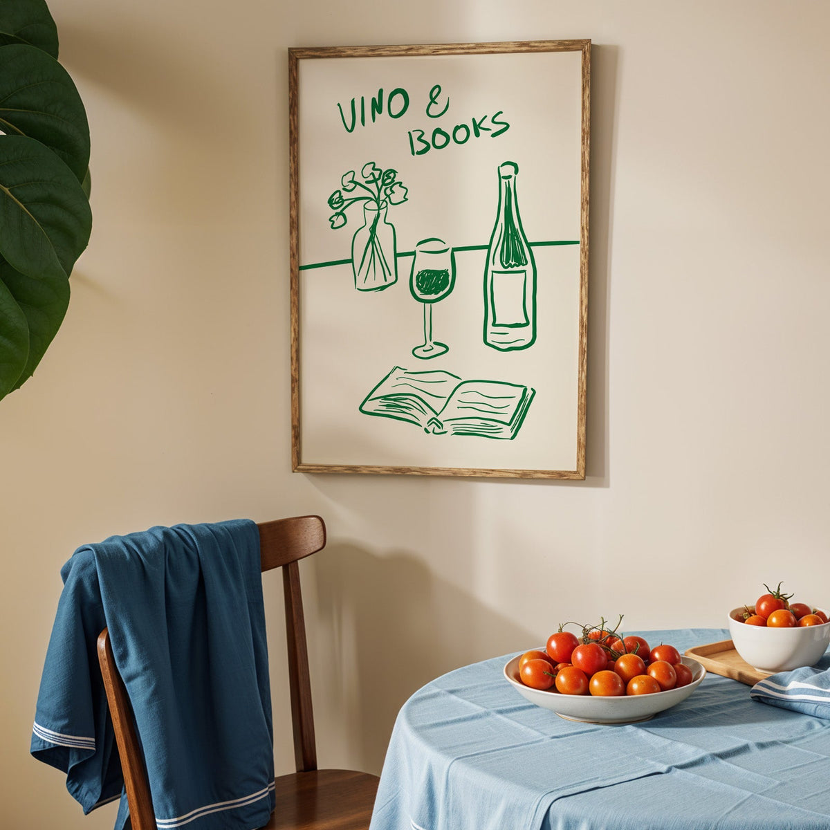 Vino and books green line print in an oak frame above a blue linen table