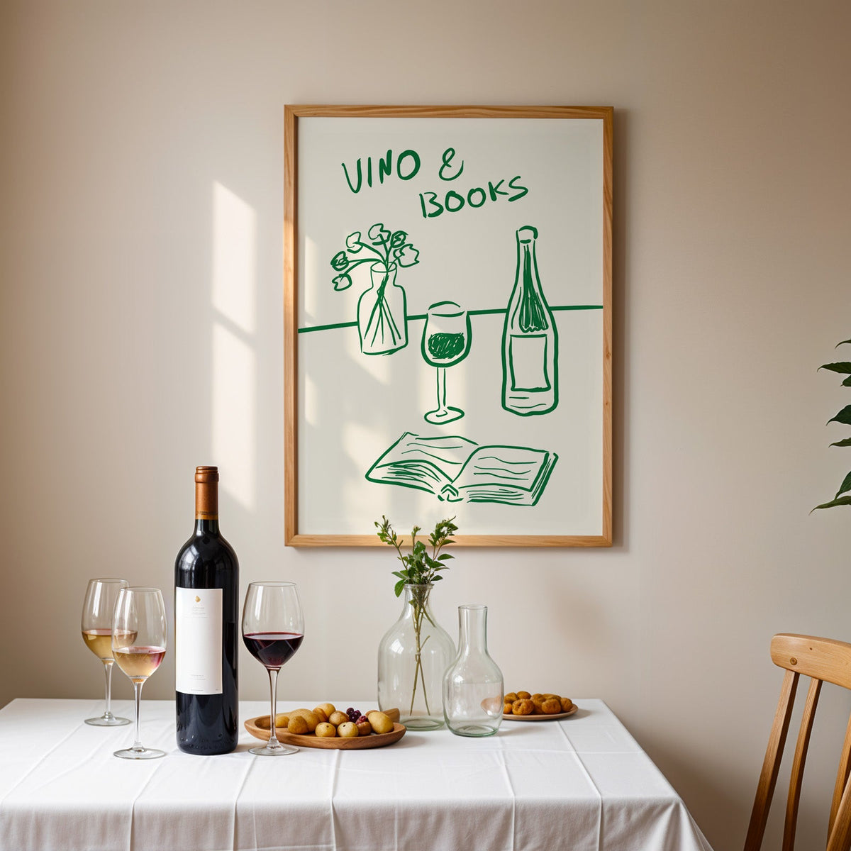 Vino and books green line print in an oak frame above a table laid with red wine