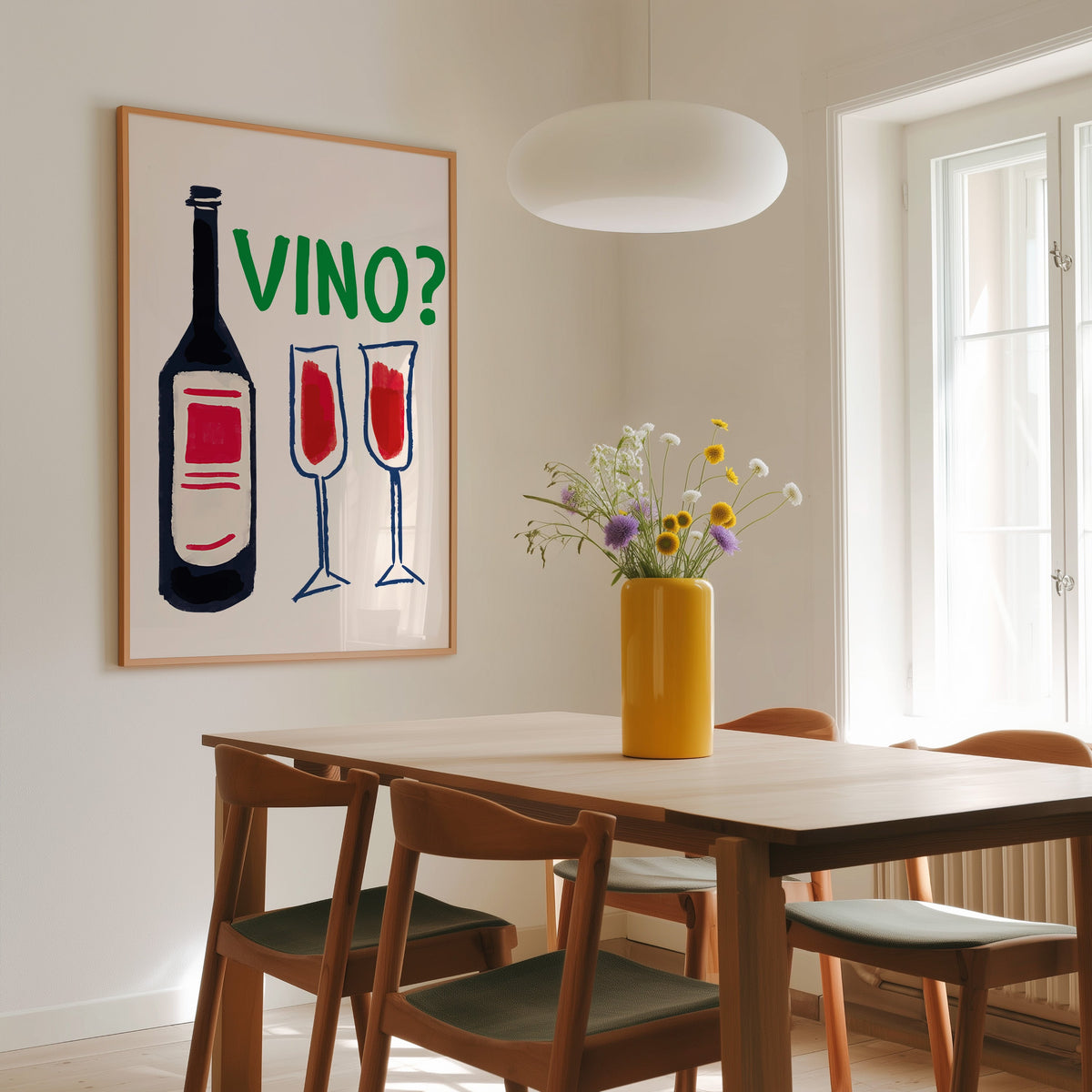 Vino navy bottle and two flutes print in a slim oak frame above a wooden dining table under a round pendant light