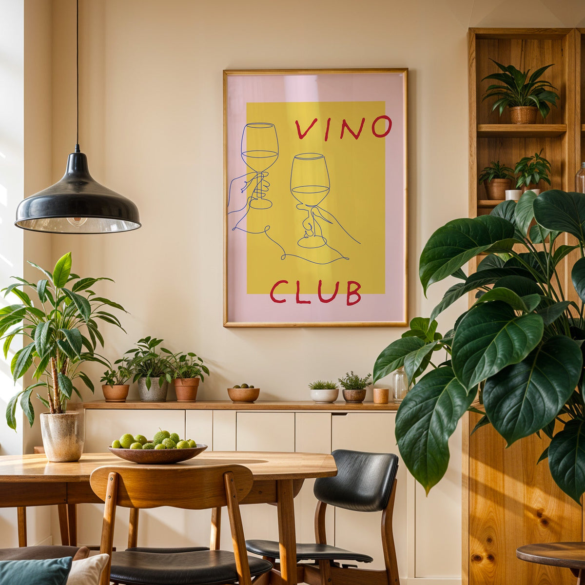 Vino Club print in an oak frame in a dining room above a plant-lined sideboard