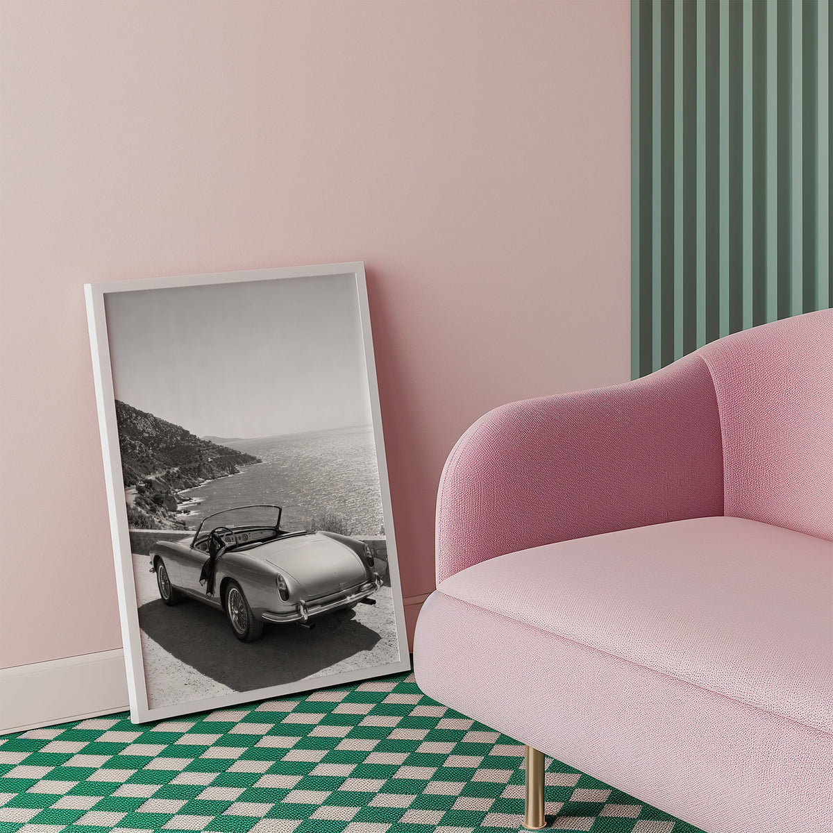 Vintage convertible parked above the sea print in a white frame beside a pink armchair on a checkered floor
