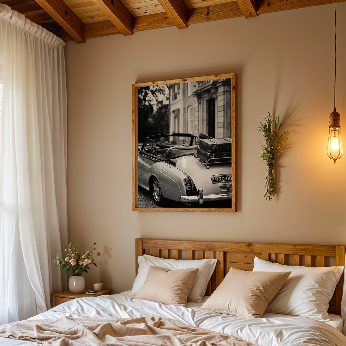 Woman in vintage convertible with leather suitcases print in a pine frame above a wood headboard bed under a pendant bulb