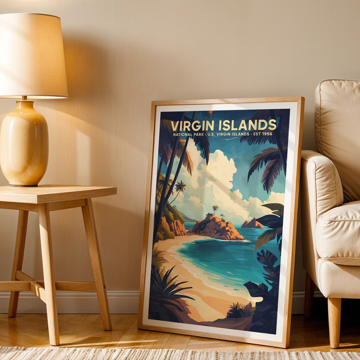 Virgin Islands print in an oak frame beside a cream armchair and an amber lamp in warm afternoon light