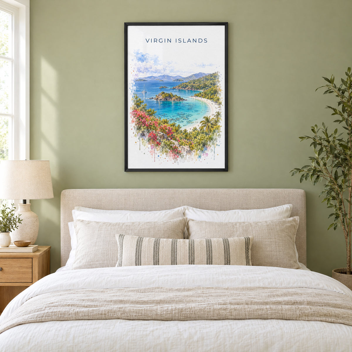 Virgin Islands National Park watercolor print in a black frame above an upholstered headboard in a sage green bedroom