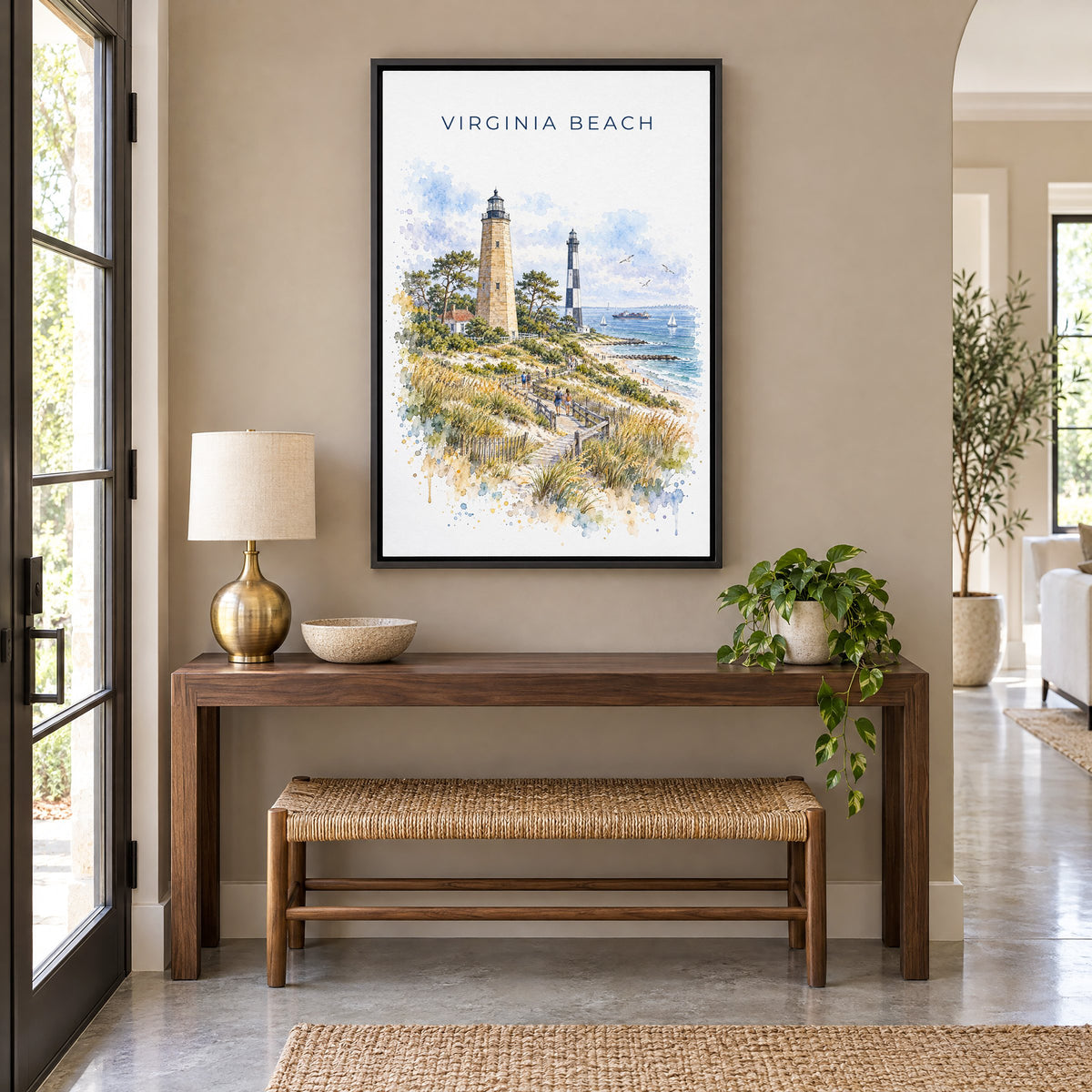 Virginia Beach watercolor print as a black floater canvas above a walnut console and woven bench in an entryway