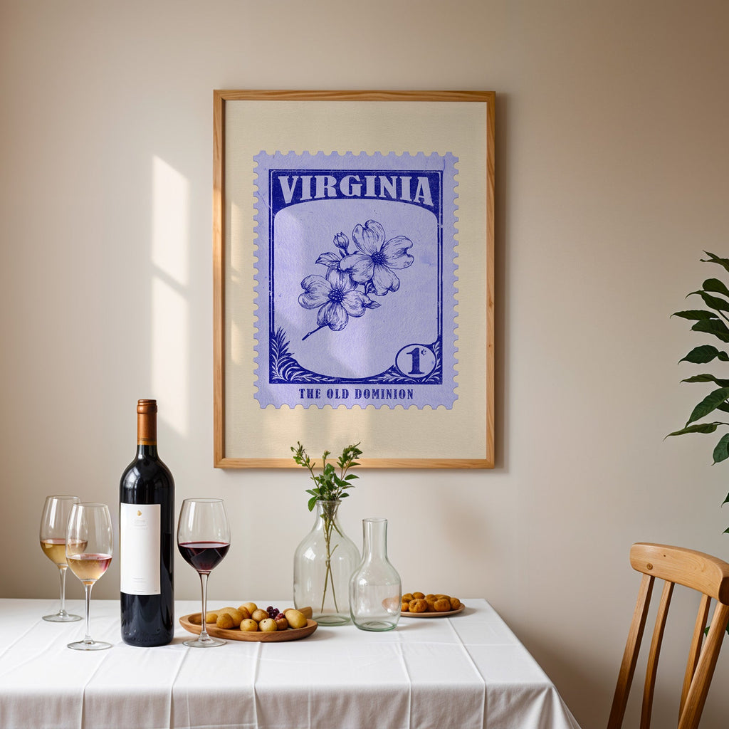 Virginia stamp print framed on the wall above a dining table set with wine, glasses and olives