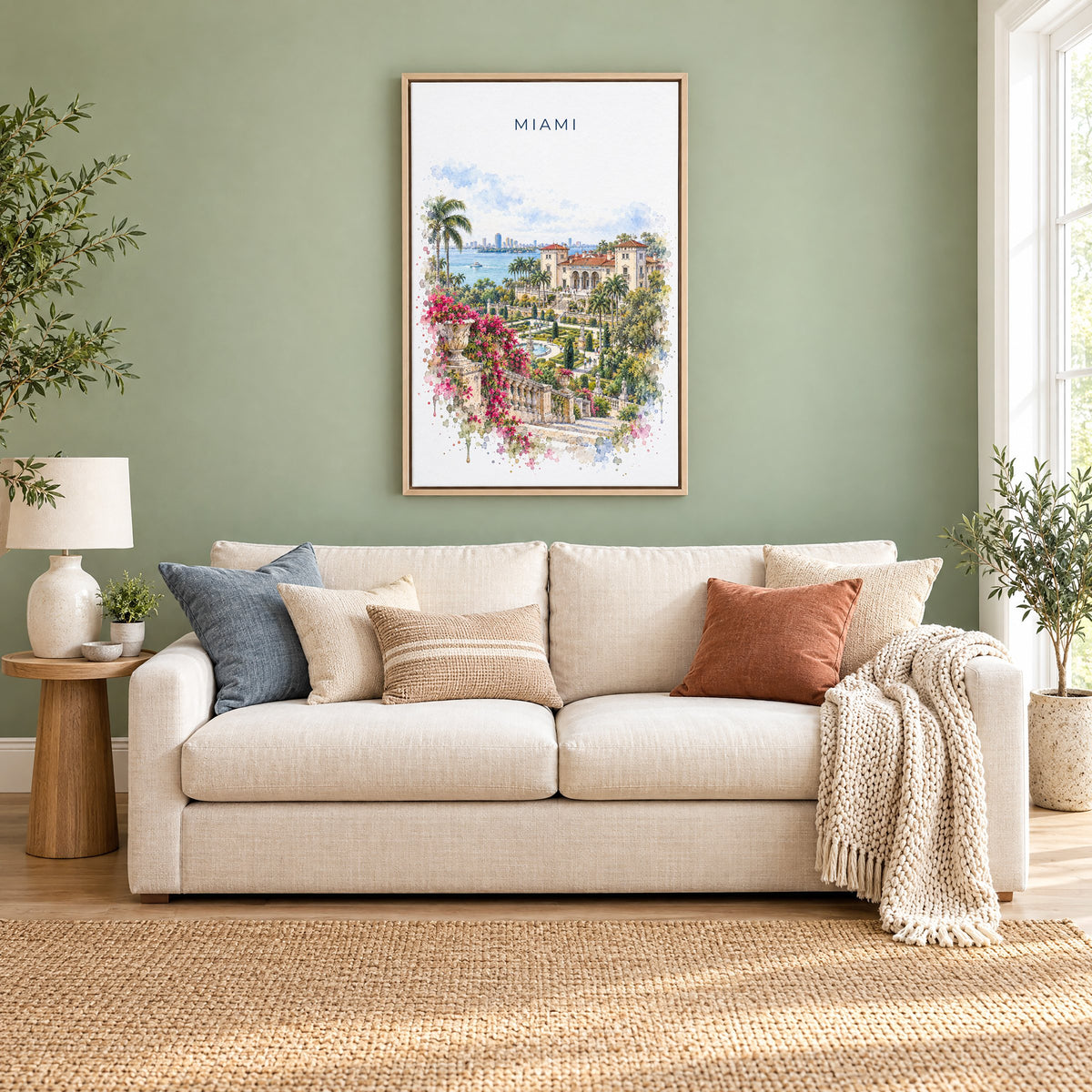 Vizcaya Miami watercolor print as a natural floater canvas above a cream linen sofa on a sage green wall