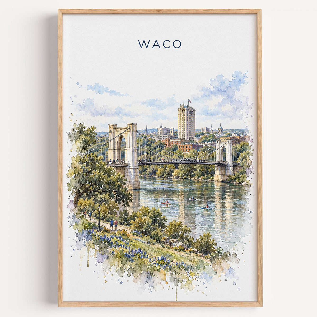 Waco watercolor print in a light oak frame on a plain white wall