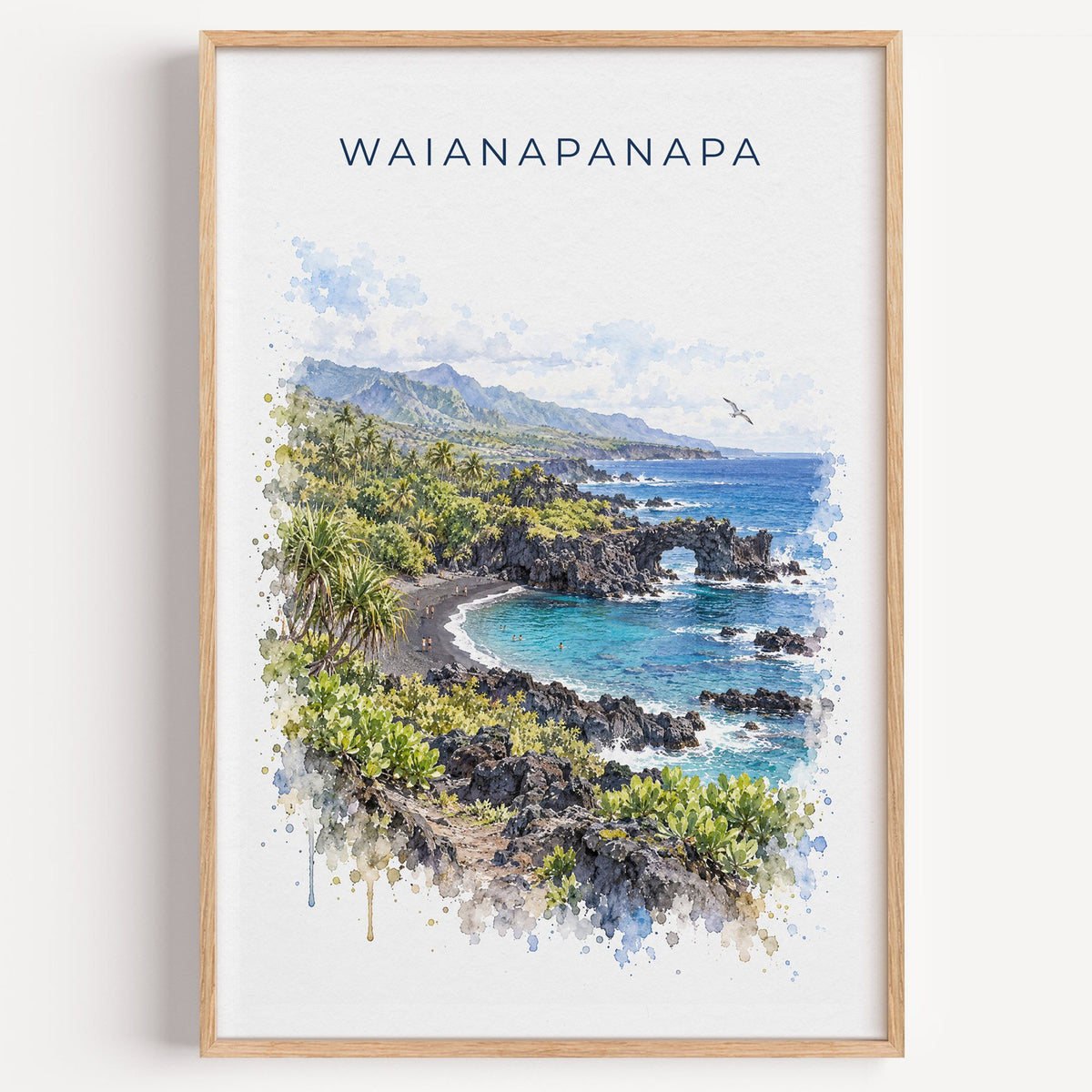 Waianapanapa State Park watercolor print in a light oak frame on a plain white wall